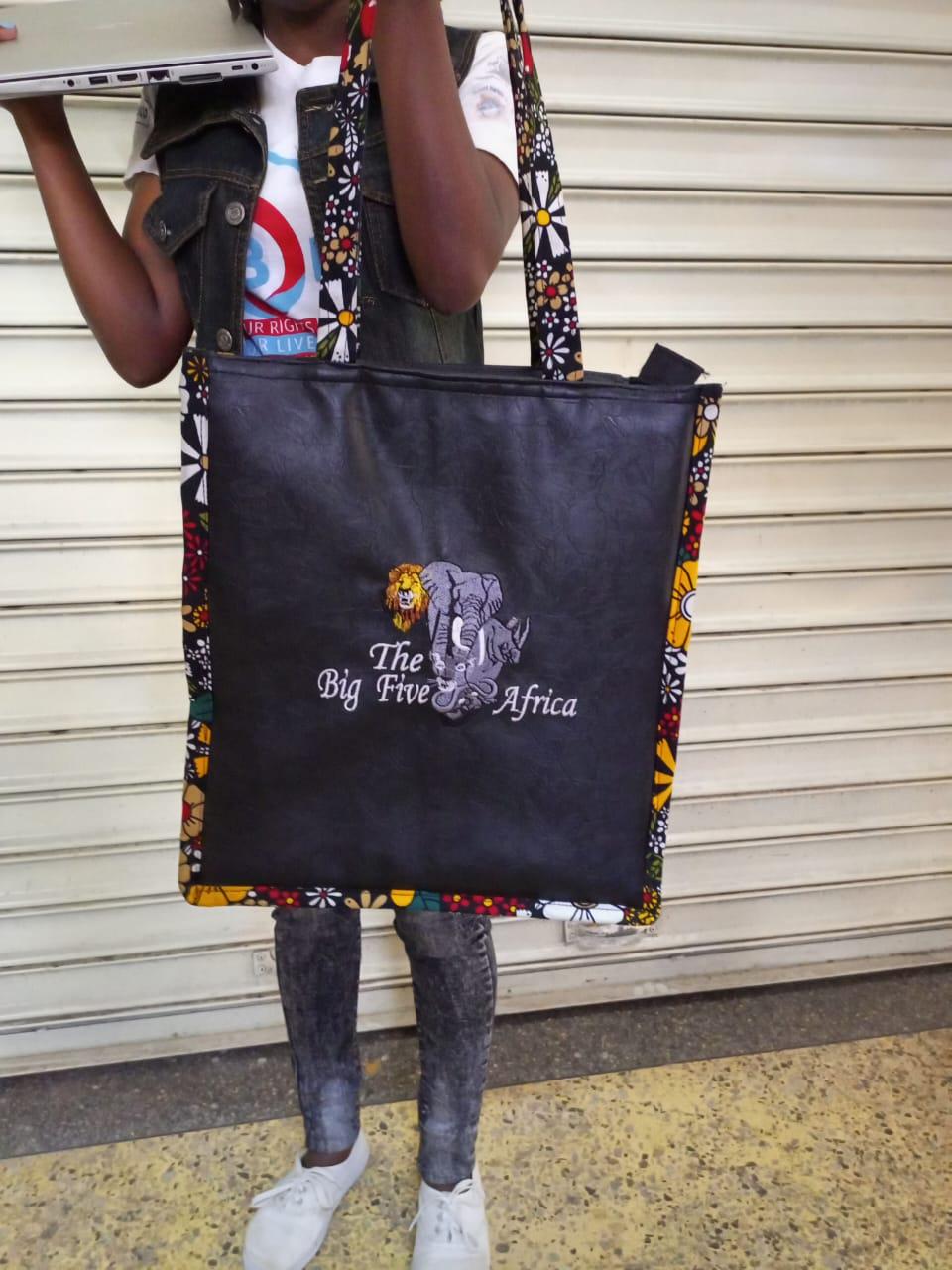 African Leather Tote bag, handcrafted laptop bag,Black woman modern African tote bag, Stylish tote bag, Brown girl bag, travel bag.