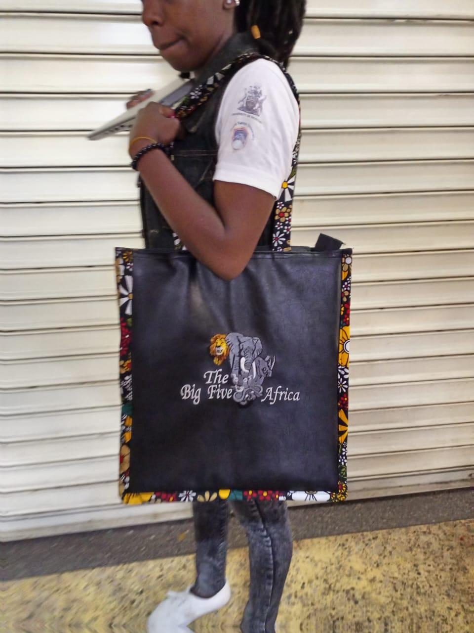 African Leather Tote bag, handcrafted laptop bag,Black woman modern African tote bag, Stylish tote bag, Brown girl bag, travel bag.