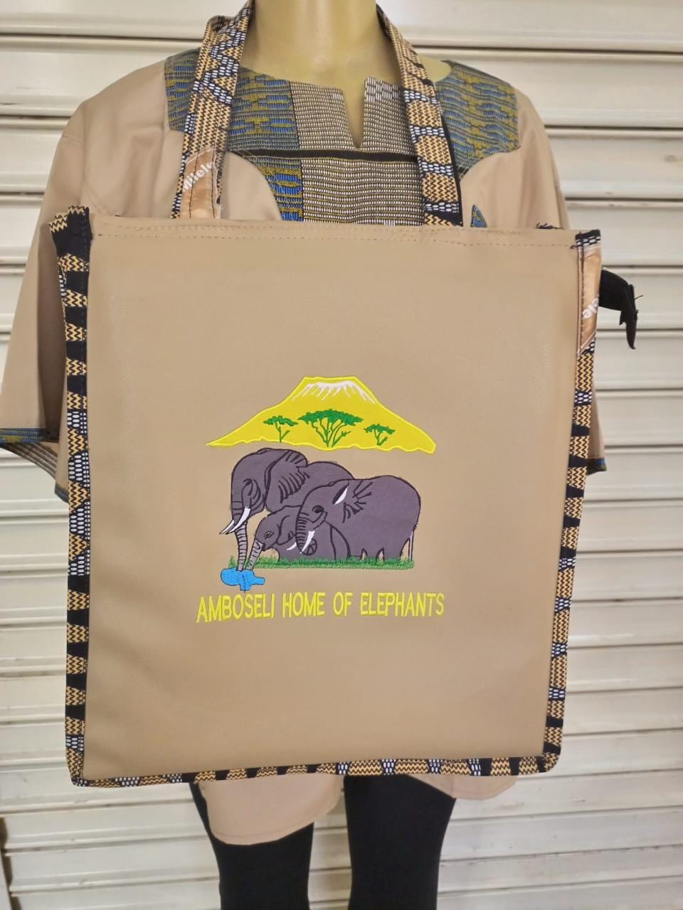 African Leather Tote bag, handcrafted laptop bag,Black woman modern African tote bag, Stylish tote bag, Brown girl bag, travel bag.