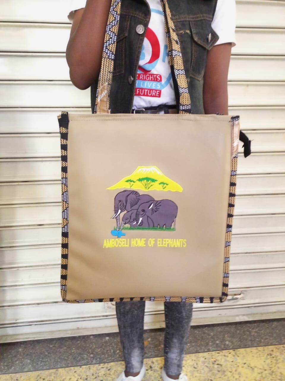 African Leather Tote bag, handcrafted laptop bag,Black woman modern African tote bag, Stylish tote bag, Brown girl bag, travel bag.