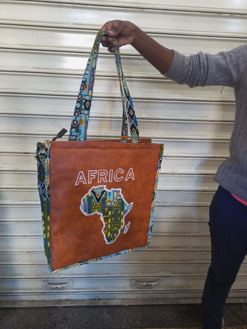 African Leather Tote bag, handcrafted laptop bag,Black woman modern African tote bag, Stylish tote bag, Brown girl bag, travel bag.