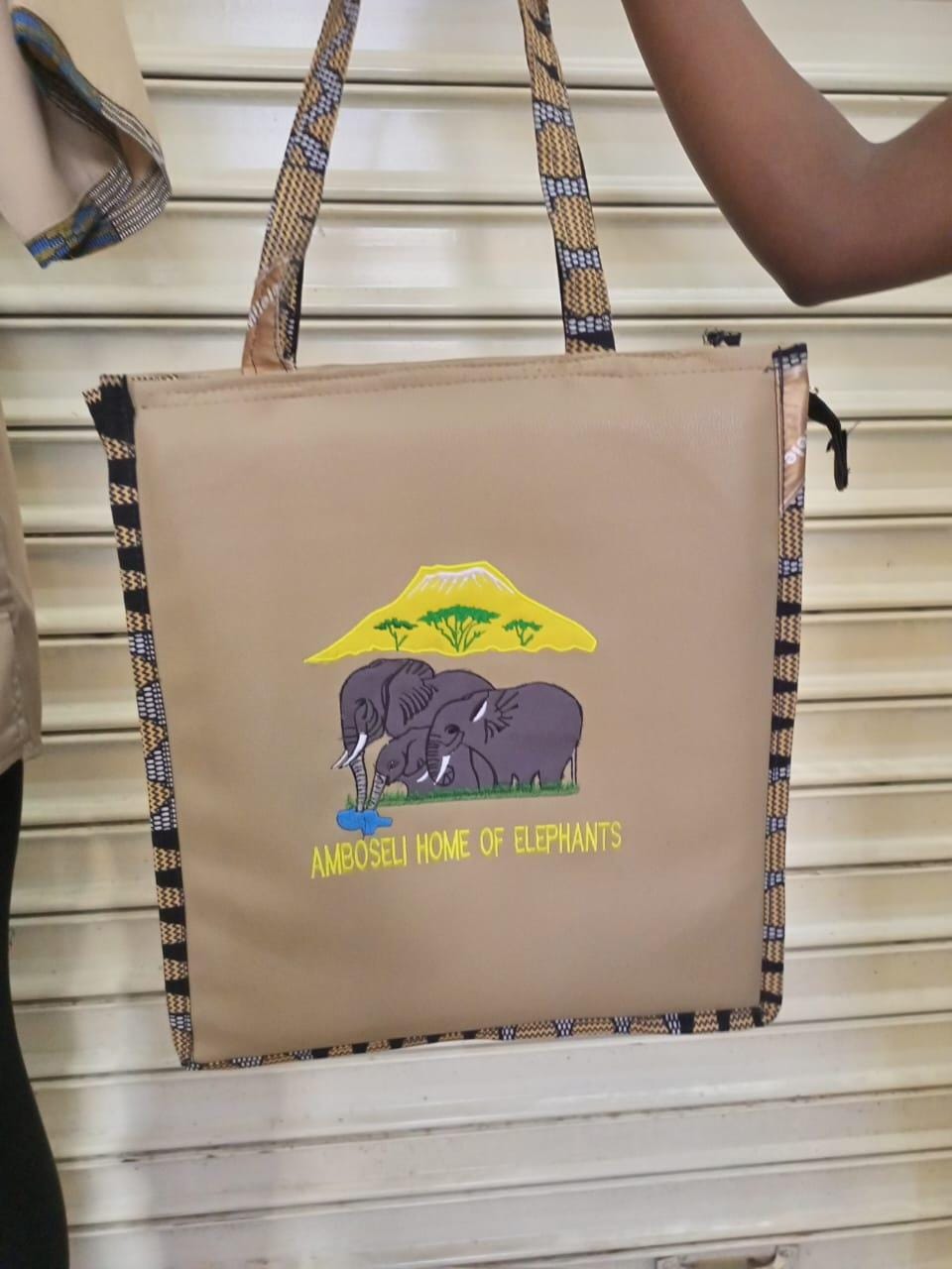 African Leather Tote bag, handcrafted laptop bag,Black woman modern African tote bag, Stylish tote bag, Brown girl bag, travel bag.