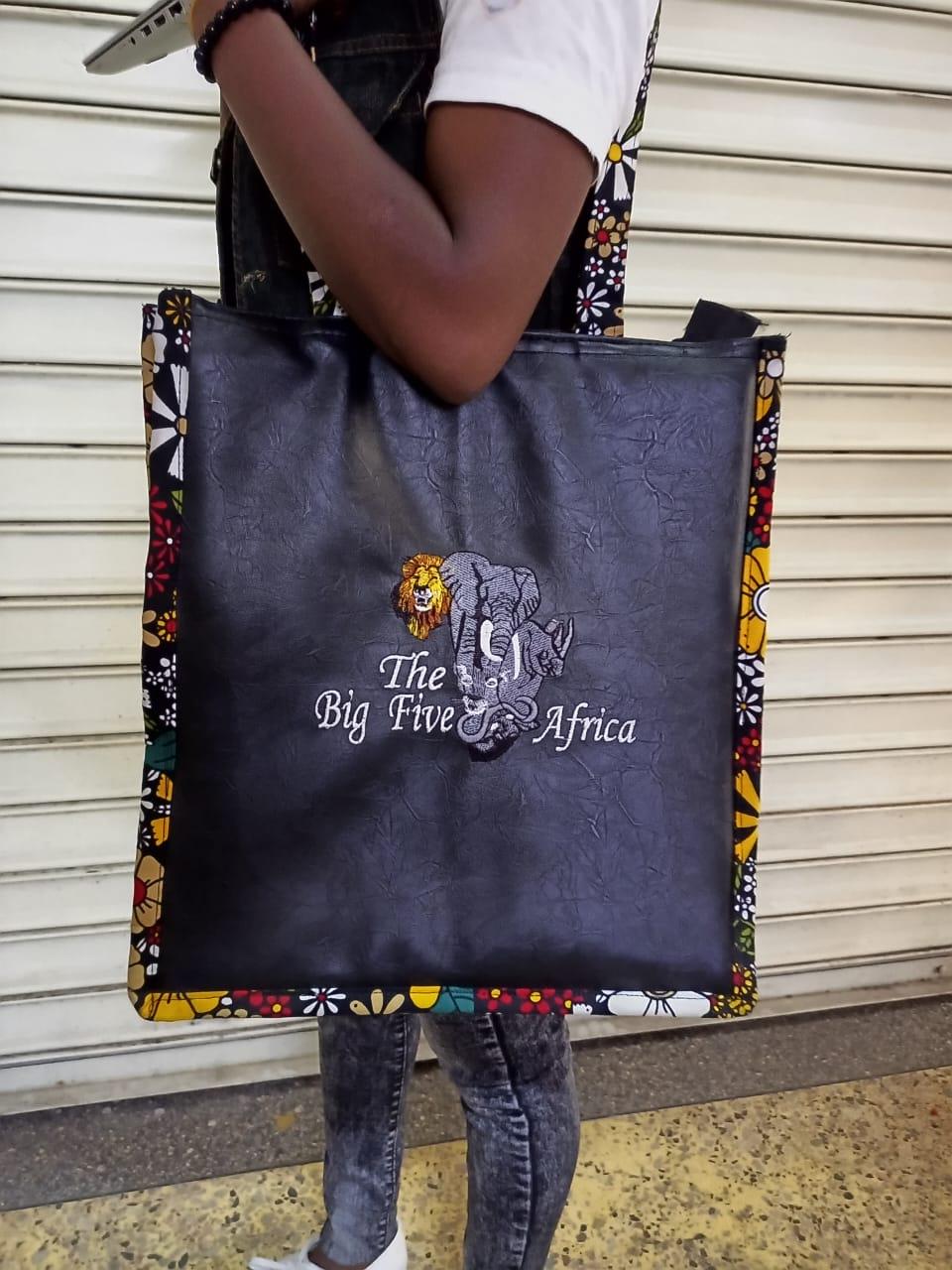 African Leather Tote bag, handcrafted laptop bag,Black woman modern African tote bag, Stylish tote bag, Brown girl bag, travel bag.