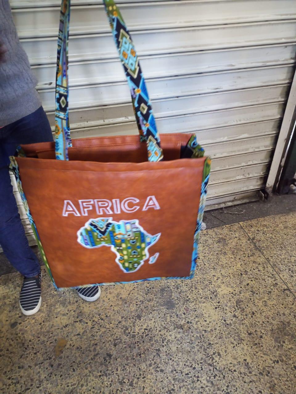 African Leather Tote bag, handcrafted laptop bag,Black woman modern African tote bag, Stylish tote bag, Brown girl bag, travel bag.