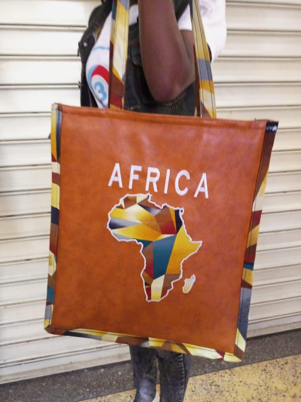 African Leather Tote bag, handcrafted laptop bag,Black woman modern African tote bag, Stylish tote bag, Brown girl bag, travel bag.