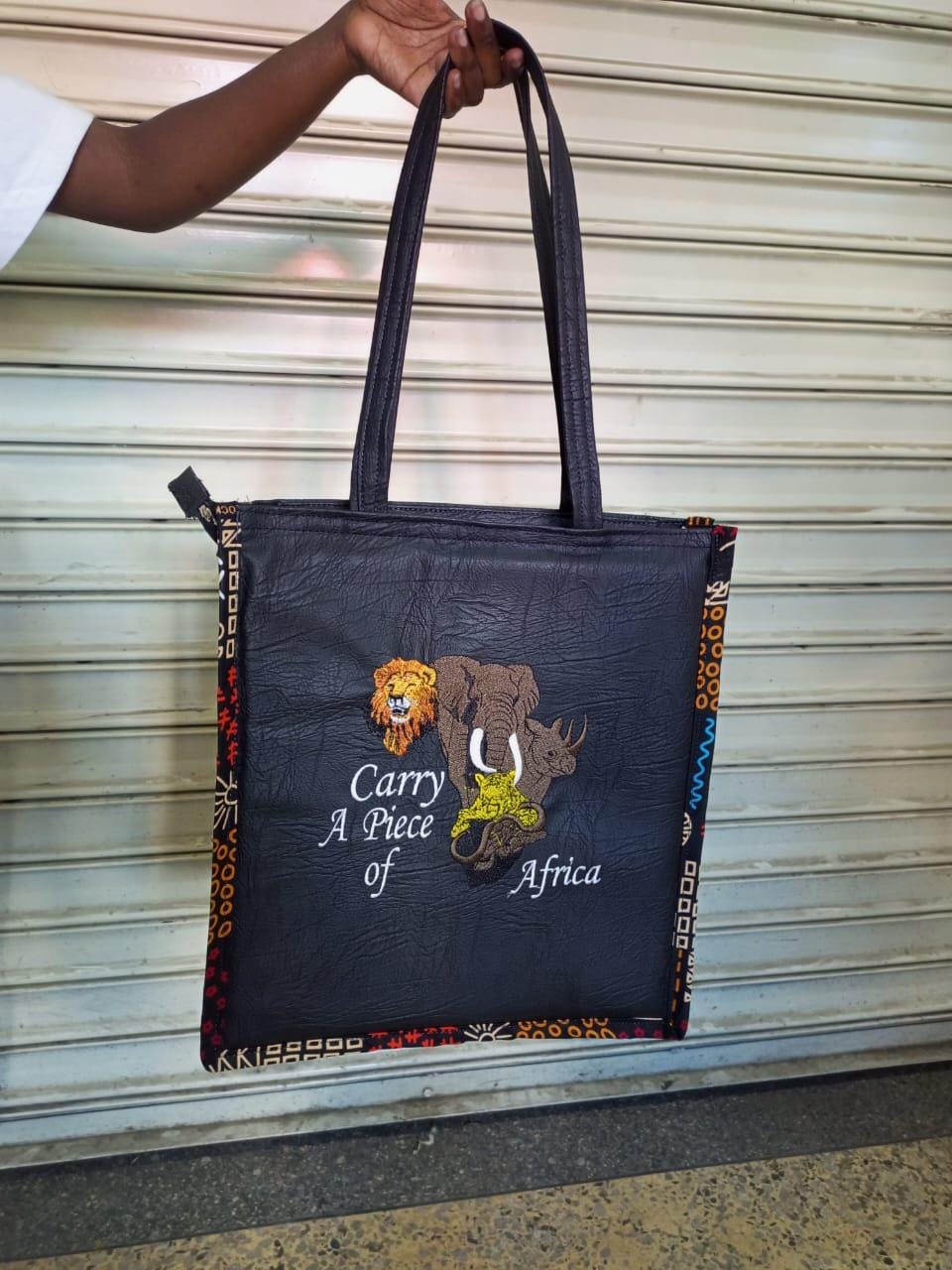 Carry a piece of Africa tote bag Leather Tote bag, handcrafted laptop bag,Black woman modern African tote bag,Stylish tote bag, mother's bag